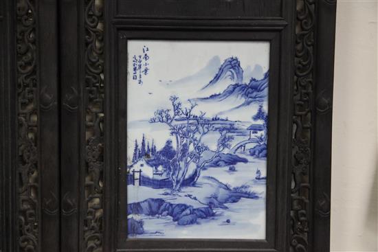 A set of four Chinese blue and white porcelain mounted wood panels, 121.5 x 38cm